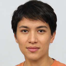 Joyful white young-adult female with short  black hair and brown eyes