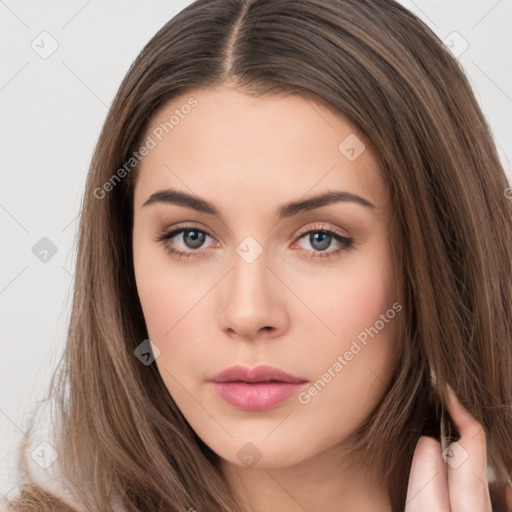 Neutral white young-adult female with long  brown hair and brown eyes