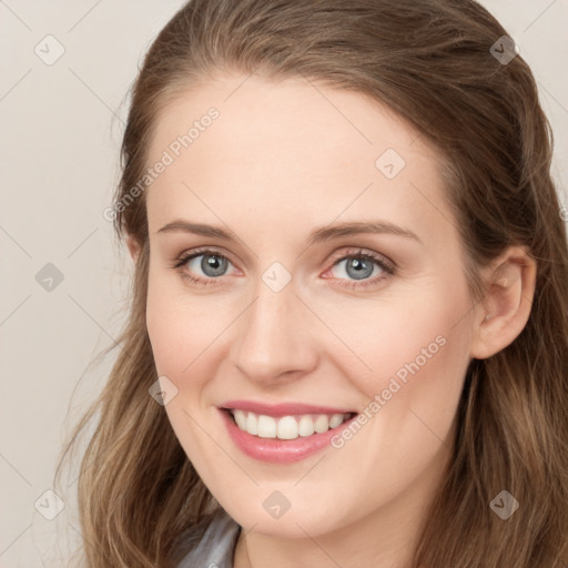 Joyful white young-adult female with long  brown hair and green eyes