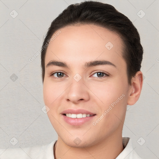 Joyful white young-adult female with short  brown hair and brown eyes