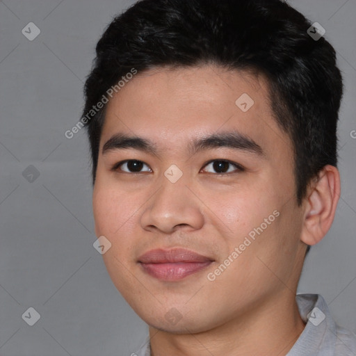 Joyful asian young-adult male with short  black hair and brown eyes