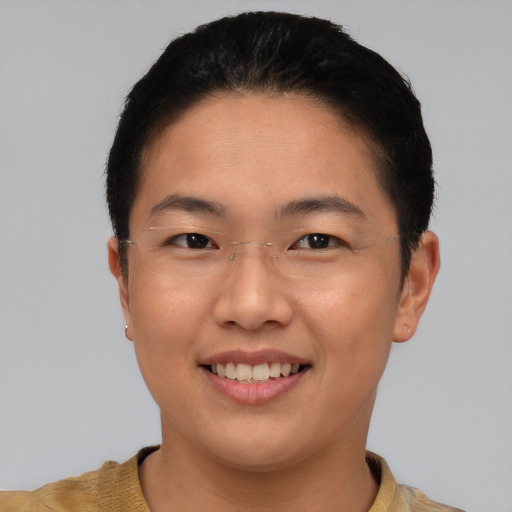 Joyful asian young-adult female with short  black hair and brown eyes