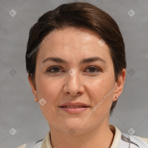 Joyful white adult female with short  brown hair and brown eyes