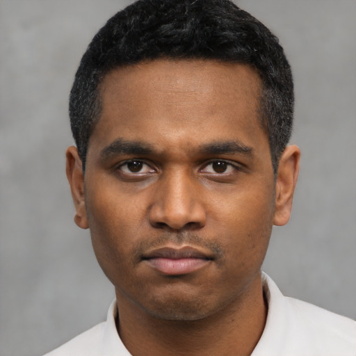 Neutral latino young-adult male with short  black hair and brown eyes