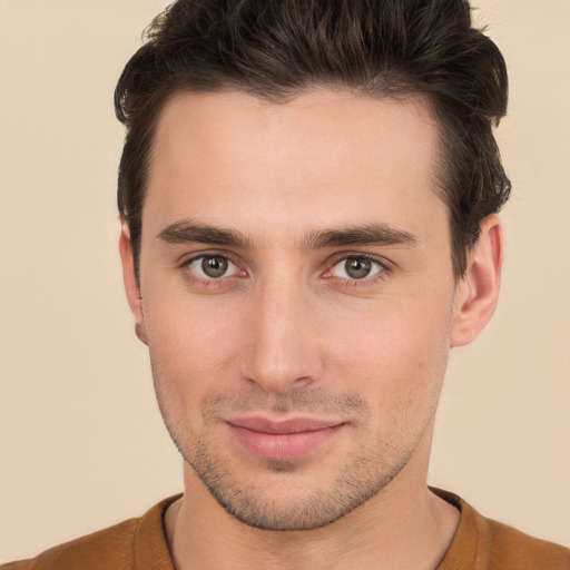 Joyful white young-adult male with short  brown hair and brown eyes