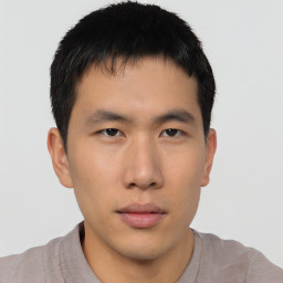 Neutral asian young-adult male with short  brown hair and brown eyes