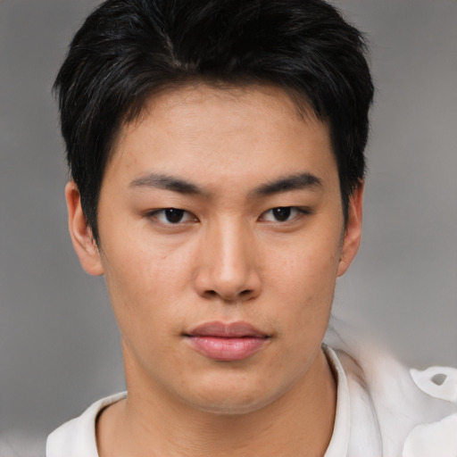 Neutral asian young-adult male with short  brown hair and brown eyes