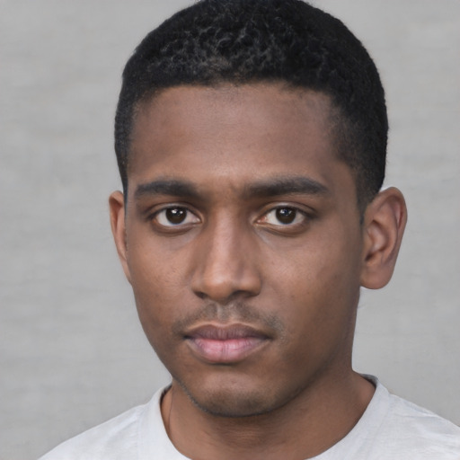 Neutral black young-adult male with short  black hair and brown eyes