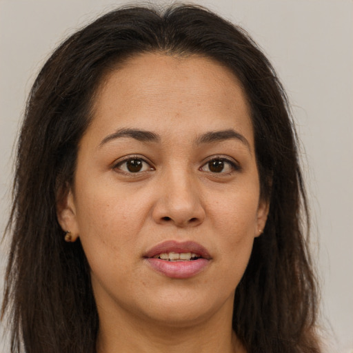 Joyful asian young-adult female with long  brown hair and brown eyes