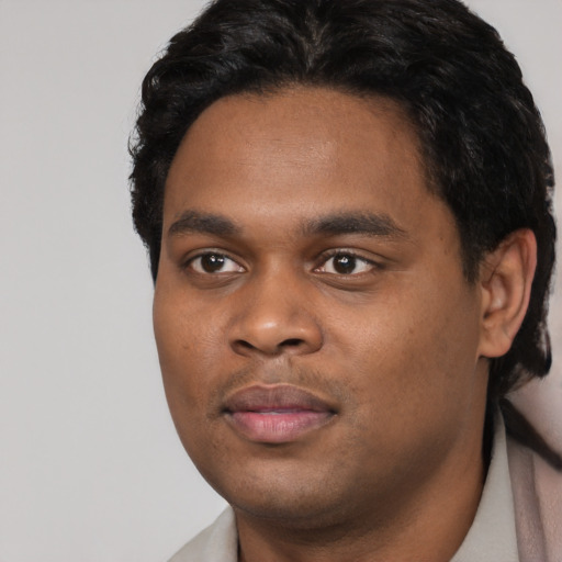 Neutral black young-adult male with short  black hair and brown eyes