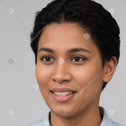 Joyful latino young-adult female with short  brown hair and brown eyes