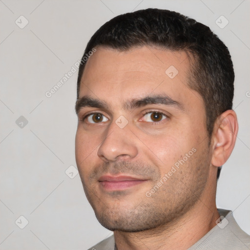 Joyful white young-adult male with short  black hair and brown eyes