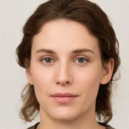 Neutral white young-adult female with medium  brown hair and green eyes