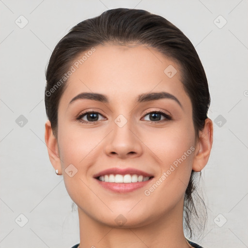 Joyful white young-adult female with long  brown hair and brown eyes