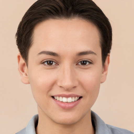 Joyful white young-adult female with short  brown hair and brown eyes