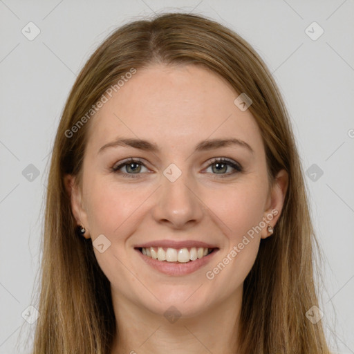 Joyful white young-adult female with long  brown hair and grey eyes