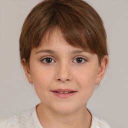 Joyful white child female with medium  brown hair and brown eyes