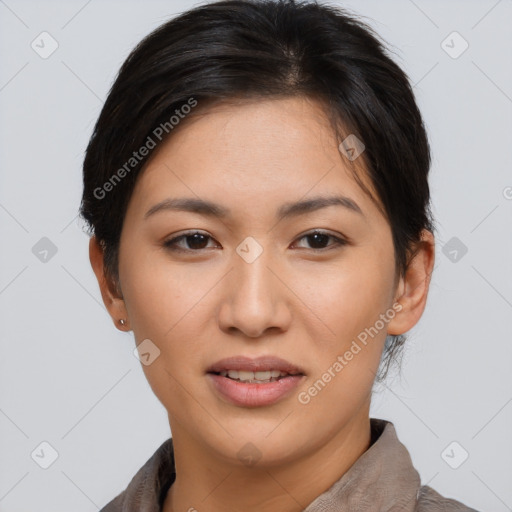 Joyful asian young-adult female with short  brown hair and brown eyes