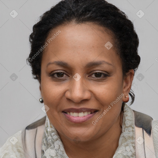 Joyful black adult female with medium  brown hair and brown eyes