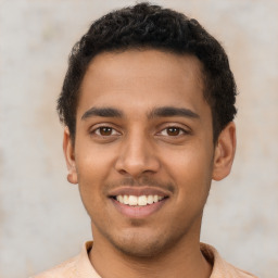 Joyful latino young-adult male with short  brown hair and brown eyes