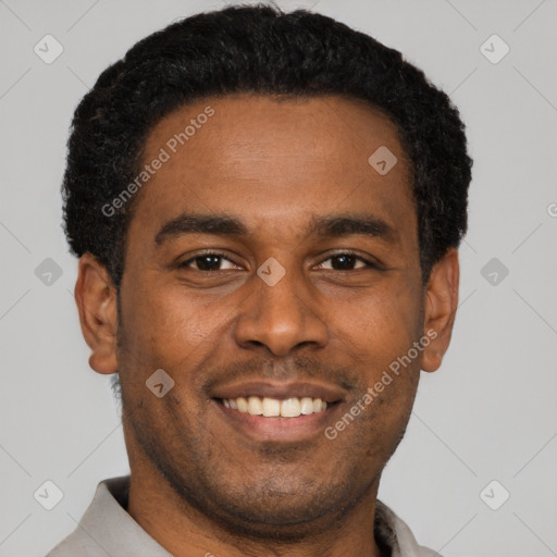 Joyful black young-adult male with short  black hair and brown eyes