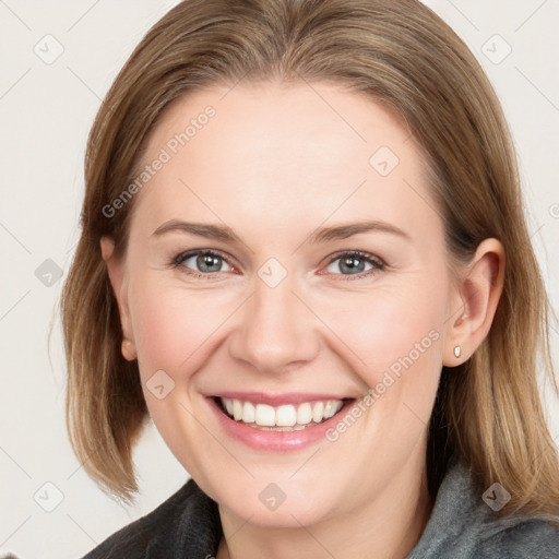 Joyful white young-adult female with medium  brown hair and blue eyes