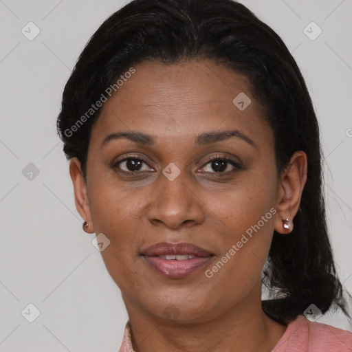 Joyful black adult female with short  brown hair and brown eyes