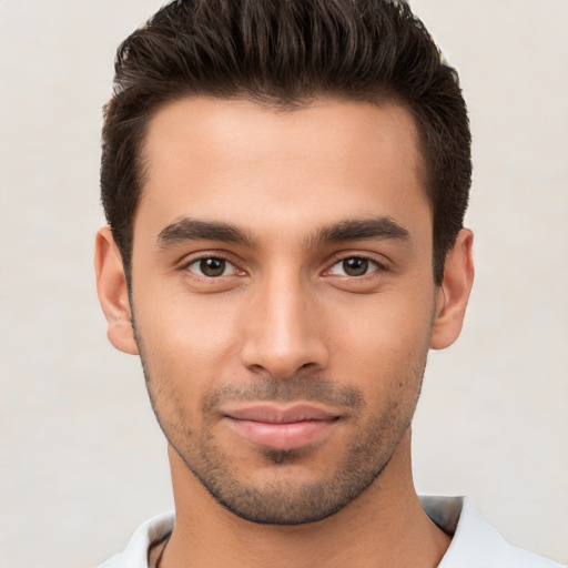 Joyful white young-adult male with short  brown hair and brown eyes