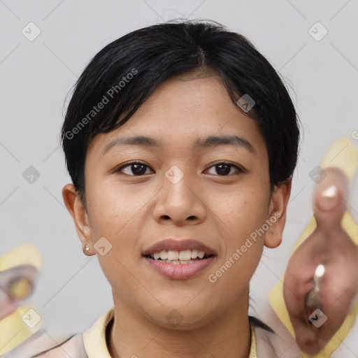 Joyful asian young-adult female with short  black hair and brown eyes