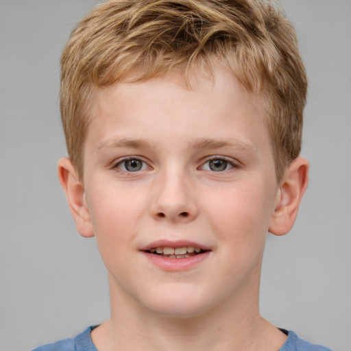 Joyful white child male with short  brown hair and grey eyes