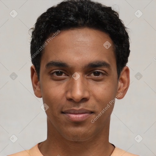 Joyful black young-adult male with short  black hair and brown eyes