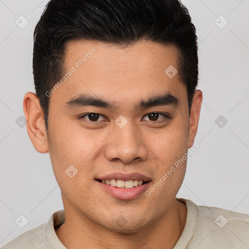 Joyful latino young-adult male with short  brown hair and brown eyes