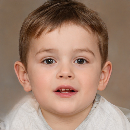 Joyful white child male with short  brown hair and brown eyes