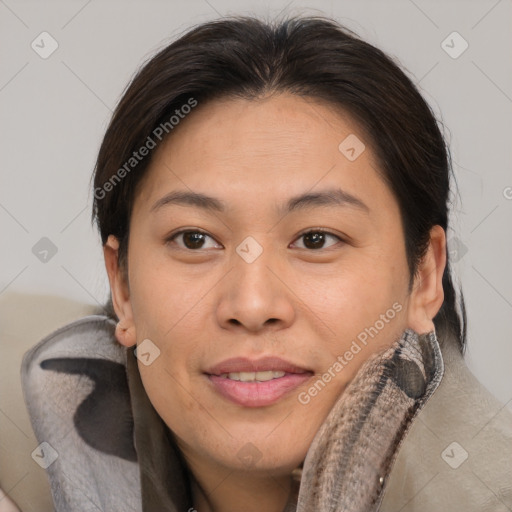 Joyful asian young-adult female with short  brown hair and brown eyes