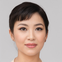 Joyful asian young-adult female with short  brown hair and brown eyes