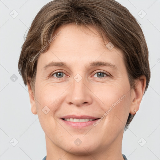 Joyful white adult female with short  brown hair and grey eyes