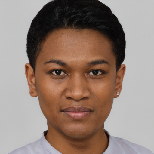 Joyful black young-adult female with short  black hair and brown eyes