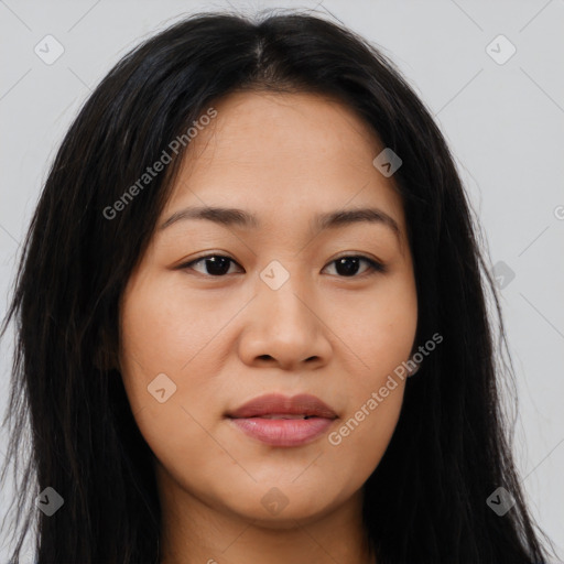 Joyful latino young-adult female with long  brown hair and brown eyes