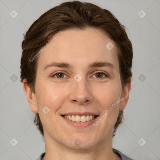 Joyful white adult female with short  brown hair and grey eyes