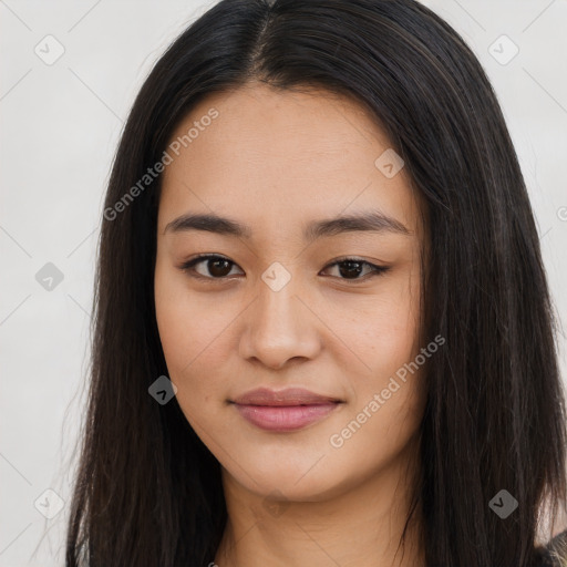 Joyful asian young-adult female with long  brown hair and brown eyes