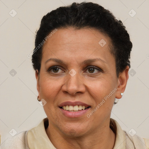 Joyful latino adult female with short  brown hair and brown eyes