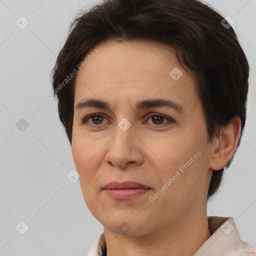 Joyful white adult female with short  brown hair and brown eyes