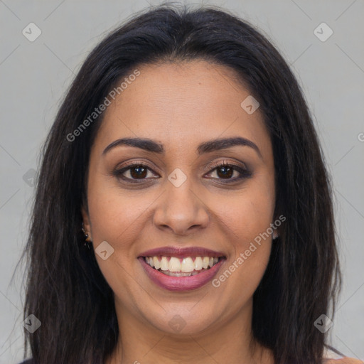 Joyful latino young-adult female with long  brown hair and brown eyes