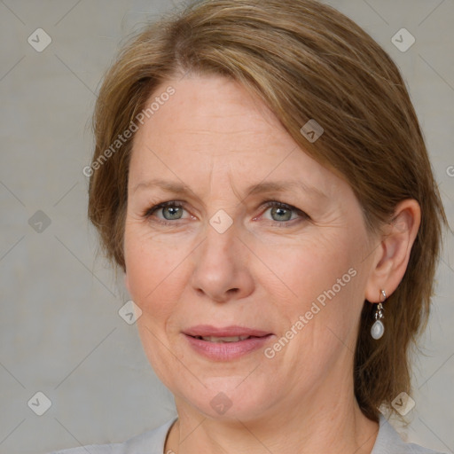 Joyful white adult female with medium  brown hair and grey eyes