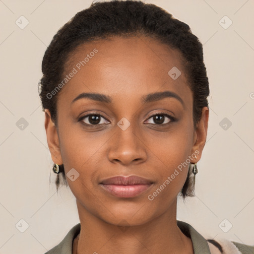 Joyful black young-adult female with short  brown hair and brown eyes