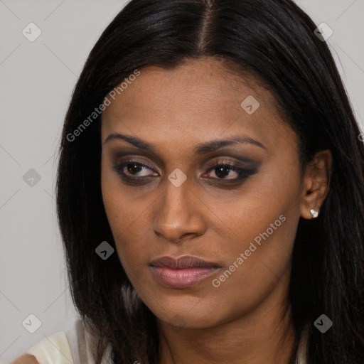 Joyful latino young-adult female with long  brown hair and brown eyes