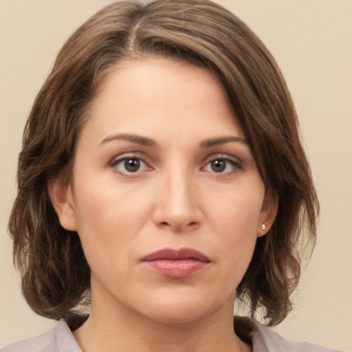 Neutral white young-adult female with medium  brown hair and brown eyes