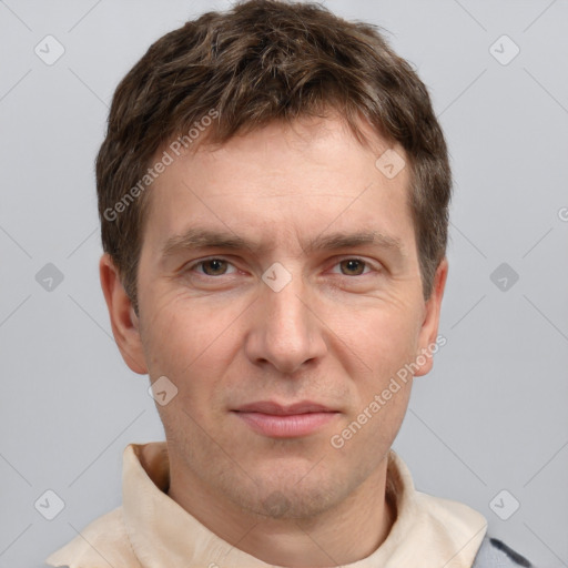 Joyful white adult male with short  brown hair and grey eyes