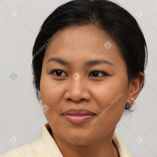 Joyful asian adult female with medium  brown hair and brown eyes