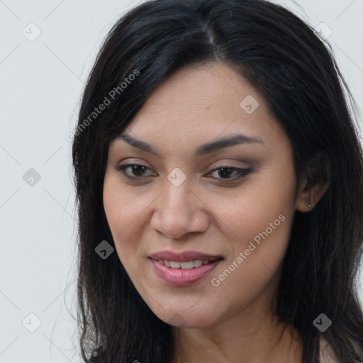 Joyful latino young-adult female with long  brown hair and brown eyes